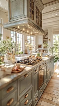 a kitchen with an oven, stove and counter tops in the middle of the room