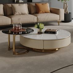 a living room with couch, coffee table and vase on the floor in front of it