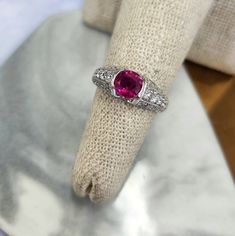 Burma, also known as Myanmar, has a long history of producing some of the finest rubies in the world. This ruby is a delightful pinkish-red color in a rounded oval shape. The platinum setting is exquisite with diamond pave set along every angle. Note there are 4 small diamonds set under the ruby, as extra accents. The ruby weighs 1.17ct and  0.77 carats of white and clean diamonds. All weights are stamped in the shank. Ring size is 6, can be sized upon request 7.3 grams of Platinum The integrity Luxury Pink Ruby Ring In Platinum, Pink Sapphire Pave Setting Ring For Gift, Pink Sapphire Rings With Pave Setting For Gift, Gia Certified Oval Pink Ruby Ring, Gia Certified Pink Diamond Ruby Ring, Pink Ruby Ring With Platinum, Pink Platinum Ruby Ring For Wedding, Pink Round Cut Ruby Ring In Fine Jewelry Style, Fine Jewelry Pink Round Cut Ruby Ring