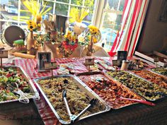 a buffet table filled with lots of food