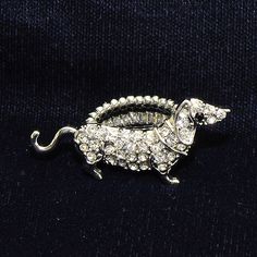 an animal brooch with crystal beads