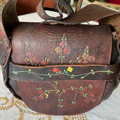 This Bag Is Truly Special And Pretty Amazing! Vintage From The 1960s Or 70shand Tooled Leather With Painted Floral Design. A Bit Of Wear On Areas Of The Painted Design (Which In My Opinion Adds To The Vintage Feel) But Otherwise Incredible Condition! Such Great Retro Boho Stylea Classic! Please See My Other Listings For More Vintage Bags! Vintage Hand-stitched Satchel For Everyday Use, Vintage Hand-stitched Bags For Everyday Use, Vintage Brown Shoulder Bag With Removable Pouch, Vintage Leather Satchel With Hand-stitched Details, Vintage Bags With Coin Pocket, Vintage Leather Pouch Satchel, Vintage Hand-stitched Crossbody Shoulder Bag, Vintage Hand-stitched Bag For Daily Use, Vintage Handmade Satchel In Brown