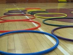 many colored rings on the floor in an indoor gym