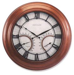 a brown and white clock with roman numerals