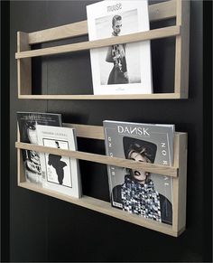 two wooden shelves with books and magazines on them