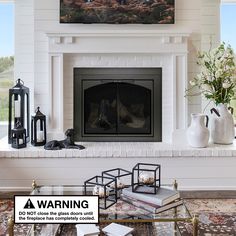 a living room with a fire place and a painting on the fireplace mantel above it