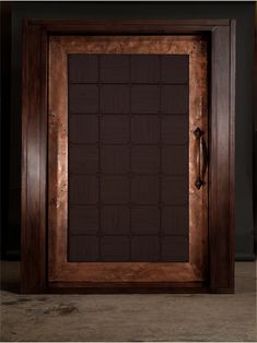 a wooden door with a brown frame on it