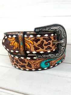 Beautiful tooled leather and hand painted belt with leopard, yellow sunflowers and turquoise scroll. 1.75" wide  Small 29"-32" Medium 32"-36" Large 36"-40" XL 40"-44" Buckle is removable with screws handmade and painted leather tooled and painted by American Darling  Not customizable Western Leather Belt, Leather Tool Belt, Western Shoes, Yellow Sunflowers, Barrel Racing, Western Leather, Painting Leather, Yellow Sunflower, Cow Hide