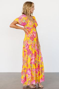 Baltic Born exclusive style Great dress for summer parties or brunch with friends Vibrant yellow with pink, ivory and green floral Flowy chiffon material with no stretch Flattering sweetheart neckline Center ruched bust Short puffed balloon sleeves with elastic at shoulder and arm Empire waist sits right under bust tri-tiered flowy skirt Fully lined except sleeves Bump friendly Self: 100% polyester, lining 100% polyester Trina is 5'6, cup size 32D, size 2 and is wearing size S Flowy Chiffon Dress, Cocktail Jumpsuit, Bright Floral Dress, Loungewear Fashion, Baltic Born, Summer Yellow, Pink Ivory, Green Floral Print, Chiffon Material