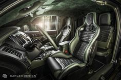 the interior of a car with black leather seats and green trims is shown in this image