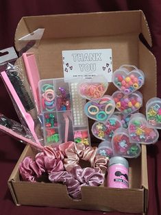 a box filled with lots of different types of crafting supplies and items in it