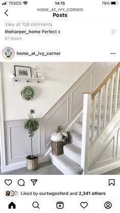 the stairs in this house have been painted white and are decorated with potted plants