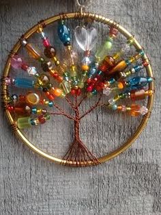 a wire tree with colorful beads hanging from it