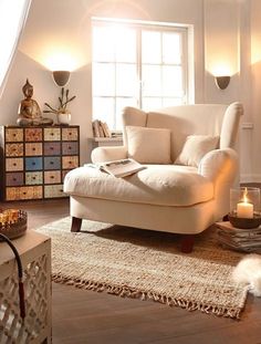 a living room filled with furniture and a cat laying on the floor next to it