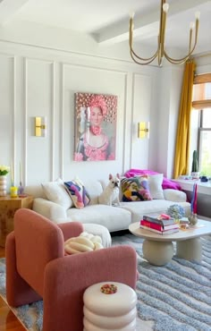 a living room filled with furniture and a painting on the wall