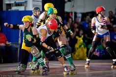 several people on roller skates in a competition