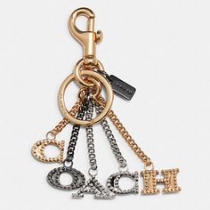 a gold and silver keychain with the word hope on it's side