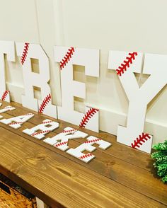 a wooden table topped with letters that spell happy new year