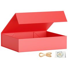 a pink box with scissors and some cards