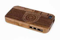 a wooden case with a camera on it