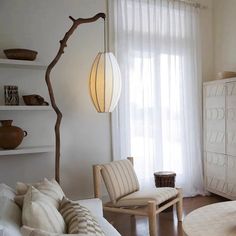 a living room filled with furniture and white walls