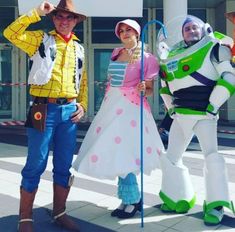 three people dressed up as toy story characters