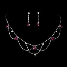 Fuchsia Teardrop Crystal Wedding Jewelry Set Add vintage elegance as well as a pop of color to your wedding or special occasion with this beautiful silver plated necklace and earring set. Clear round and fuchsia teardrop crystal rhinestones are interspersed in a charming vintage inspired design. This jewelry set would be perfect for the bride or her bridesmaids. Size: The necklace is 15 1/2" long with a 3 1/2" extender. The pierced earrings are 1 1/4" long. Color: Silver/Fuchsia. Style: ne8000f. Fuchsia Necklace, Vintage Wedding Accessories, Winter Wedding Accessories, Prom Jewelry Sets, Veil Accessories, Crystal Wedding Jewelry, Gold Bridesmaids, Pearl Jewelry Wedding, Prom Jewelry