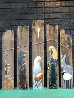 the wooden nativity scene has been painted on