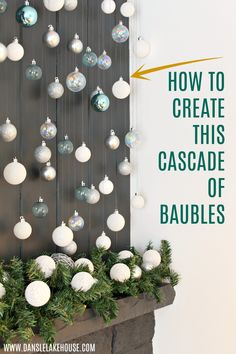 a fireplace mantel with ornaments hanging from it and the words how to create this cascade of baubles