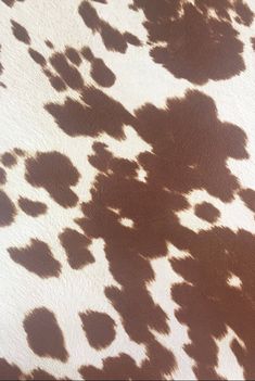 an animal print pattern is shown in brown and white colors on a leather material background