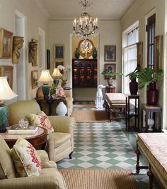 a living room filled with lots of furniture and decor