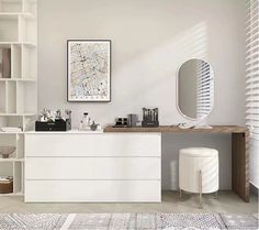 a bathroom with a large mirror and white cabinets