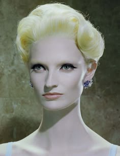 a mannequin with blonde hair and blue eyes