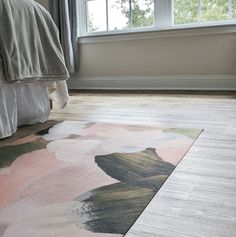 a bedroom with a large rug on the floor