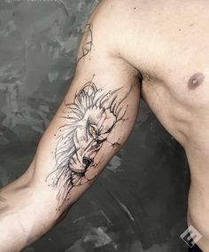 a man's arm with a lion tattoo on it and his head in the middle