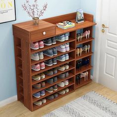 a wooden shoe rack filled with lots of shoes