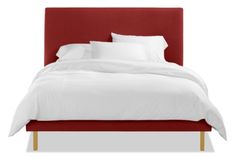 a bed with white sheets and pillows on top of it's headboard, in front of a white background