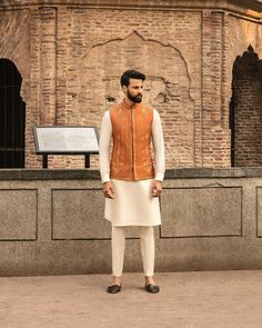 This item is made specially for you by hands with love  Item Contains:  Kruta  Vest and  Pants  Fabrics :   Luxury silk  Colours :  Cream kurta pyjama & Orange vest  Style and Designs :  Kurta has mandarin collar and long sleeves with a full button placket symmetric hem up to knee and multiple slits Vest coat has mandarin collar and five button placket with straight cut bottom design has two pocket with bone and it is hand embroidered with dabka golden dabka work all over embroidery motifs  Trou Engagement Suits, Mendhi Outfit, Coat And Pants, Mehndi Outfit, Wedding Kurta