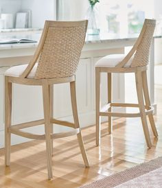 two stools sitting next to each other in a kitchen