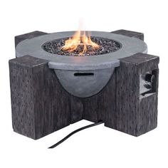 an outdoor fire pit is shown with flames coming out of the top and bottom part