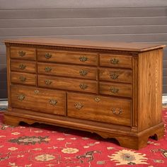 a large wooden dresser sitting on top of a rug