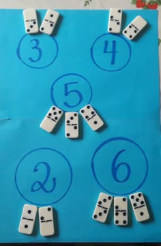 a blue paper bag with numbers and dices on it