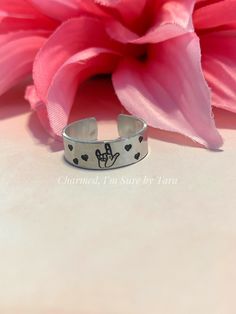 This listing is for 1 hand stamped cuff ring. This ring is made out of 18 gauge aluminum which is a lightweight and pliable metal. Aluminum is great for everyday wear as it will not tarnish like other metals. However, because this is a soft metal, repeated opening and closing of your ring is not recommended as it will weaken the metal. The impressions are darkened with a permanent ink, but the ink can fade over time. Should this happen to your piece, simply go over the impression with a Sharpie Motivational Jewelry, Stamped Ring, Hand Stamped Ring, Sharpie Marker, Stamped Rings, Sterling Silver Stacking Rings, Cuff Ring, Silver Stacking Rings, Cuff Rings