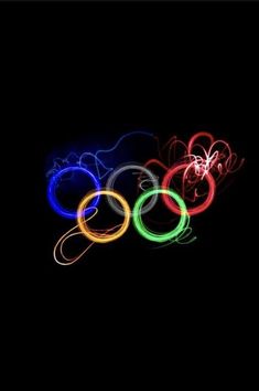 the olympic rings glow brightly in the dark