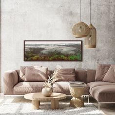 a living room filled with furniture and a painting hanging on the wall above it's coffee table