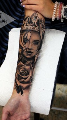 a woman with a crown on her head is shown in this tattoo artist's photo