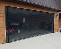 an image of a garage that is in the process of being cleaned and installed with glass doors