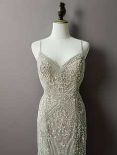 Step into a world of elegance and sophistication with our Elegant Champagne Beaded Sequin and Feather Dress. This enchanting gown features a stunning champagne hue that exudes luxury and grace. The bodice is adorned with intricate beadwork and shimmering sequins, creating a dazzling effect that is sure to turn heads. Intricate Beadwork and Sequins: The bodice is meticulously decorated with intricate beadwork and sequins, offering a touch of glamour and sophistication that enhances the dress's overall appeal. Delicate Spaghetti Straps: The elegant spaghetti straps provide a refined and graceful silhouette, adding to the dress's feminine charm. Feather Trimmed Hem: The dress cascades into a feather-trimmed hem, creating a dramatic and captivating finish that ensures all eyes will be on you. Sequin Champagne Dress, Sequin And Feather Dress, Simple Satin Wedding Dress, Nontraditional Wedding Dress, Wedding Dresses High Low, Champagne Evening Dress, Fairy Wedding Dress, Nye Dress, Gothic Wedding Dress