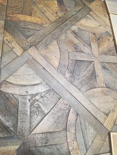 a close up of a wooden floor with different patterns on it