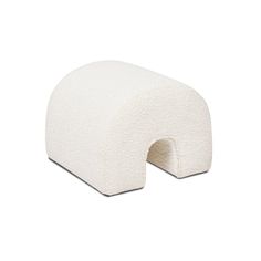 a white pillow that is shaped like an arch